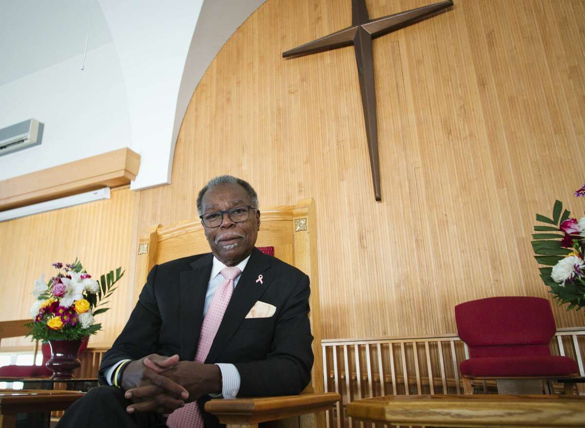 The Rev. Leonard Comithier, Jr., the pastor at Macedonia Baptist Church, poses for a photo in the sanctuary at his church in Colonie this autumn. He is retiring after 35 years leaving a legacy of music, social justice fights and community service. (Paul Buckowski/Times Union)