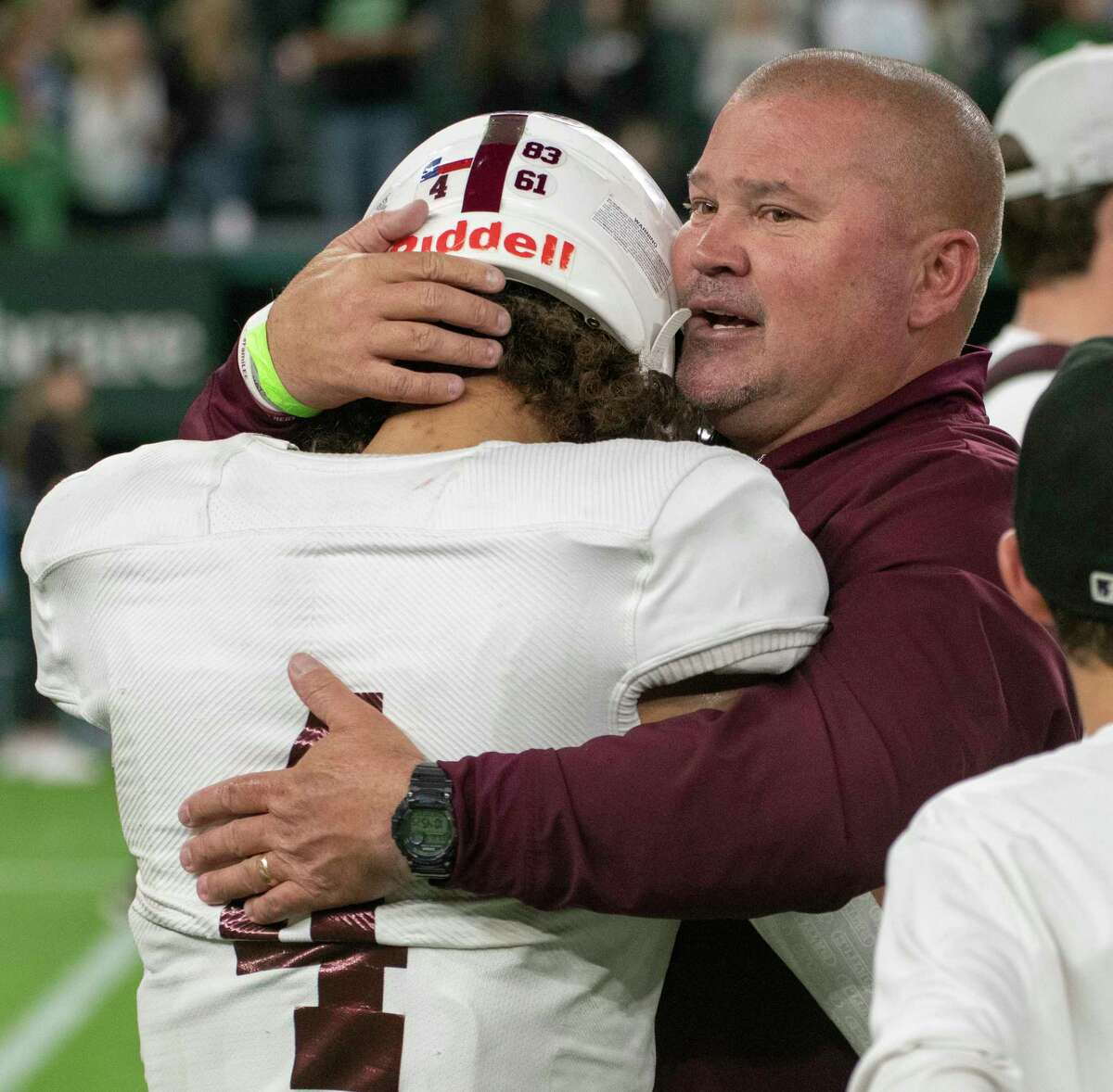 Legacy High coach Clint Hartman tries to offer some words of encouragement to Donny Bishop 11/20/2021 during the Class 6A Division 1 area round playoff against South Lake Carroll at Globe Life Field in Arlington with a final score of South Lake 42, LHS 7. Tim Fischer/Reporter-Telegram