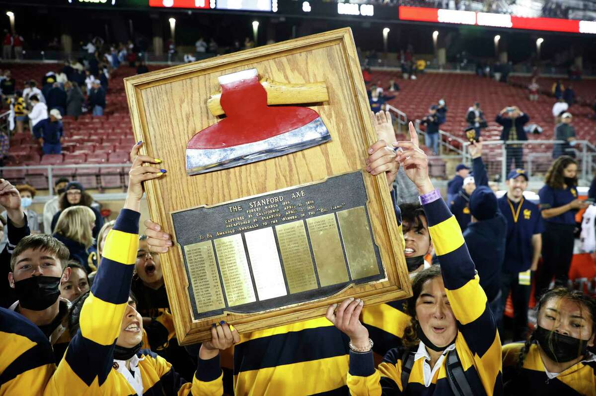 Members of the University of California Rally Committee raises the Stanford Axe after winning the annual Big Game against Stanford in Stanford, Calif. Saturday, Nov. 20, 2021.