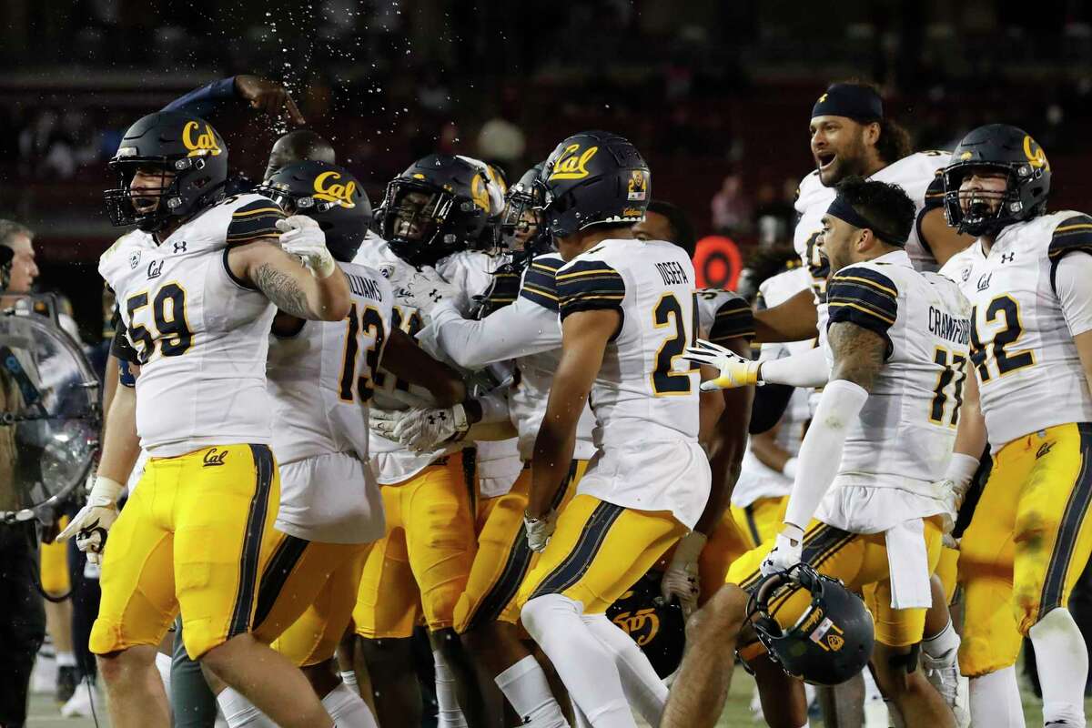 Members of the California Golden Bears Football Team celebrate on the sideline during the fourth quarter of the annual Big Game against Stanford in Stanford, Calif. Saturday, Nov. 20, 2021.