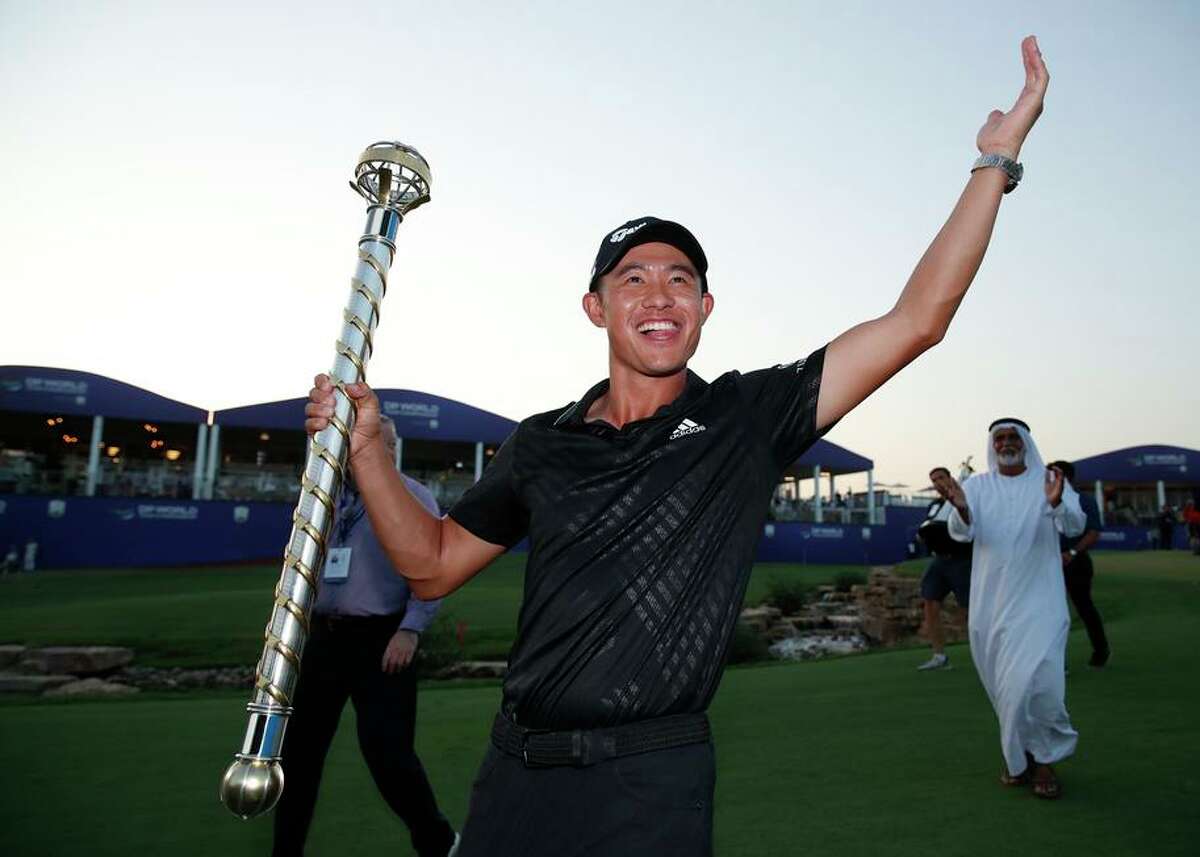 Collin Morikawa is shown with the DP World Tour Championship trophy as he captures the the Race to Dubai.