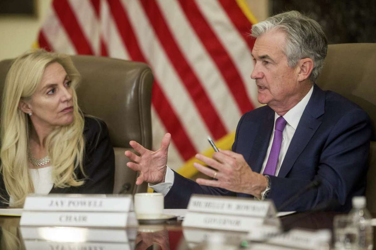 Jerome Powell, chairman of the U.S. Federal Reserve, speaks while Lael Brainard, the president's pick to replace vice chair Richard Clarida, listens during an event at the Federal Reserve in Washington on Oct. 4, 2019.