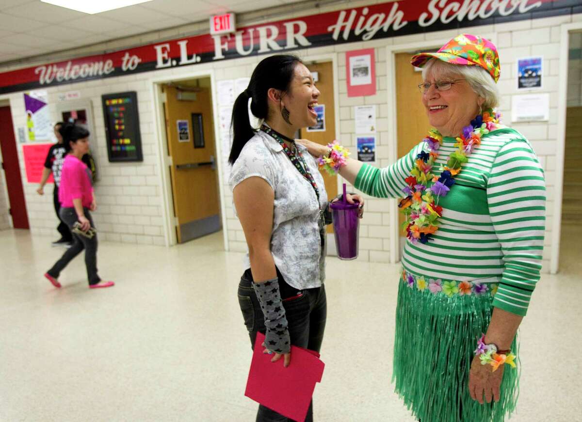 Furr High School principal Dr. Bertie Simmons, right, shares a laugh with senior Linzhe Real on the last day of school Thursday, May 31, 2012, in Houston. ( Brett Coomer / Houston Chronicle )