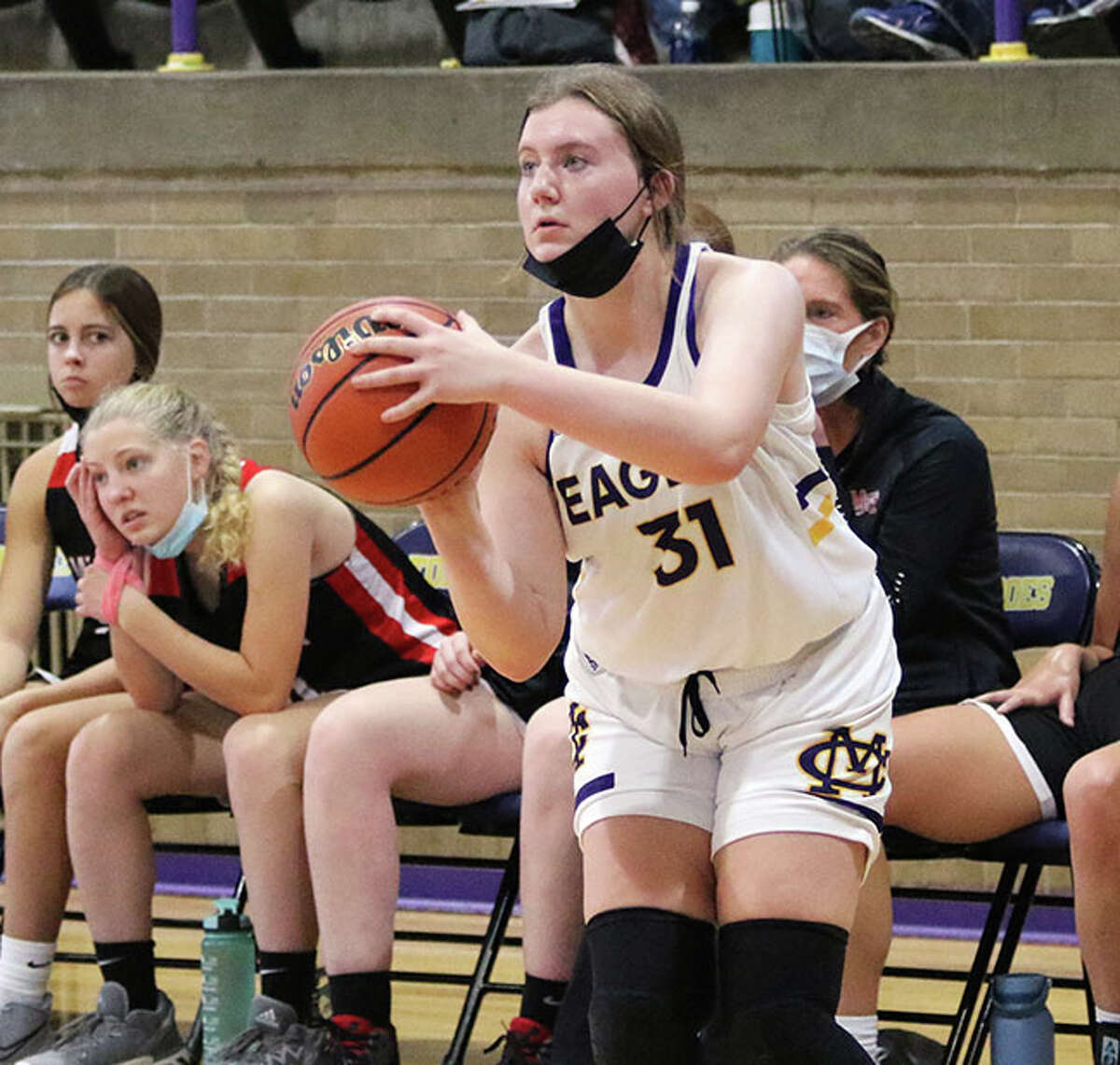 CM junior Olivia Durbin eyes one of the 12 3-pointers she made in a 42-point scoring day Saturday against Mount Zion in the Taylorville Tourney.