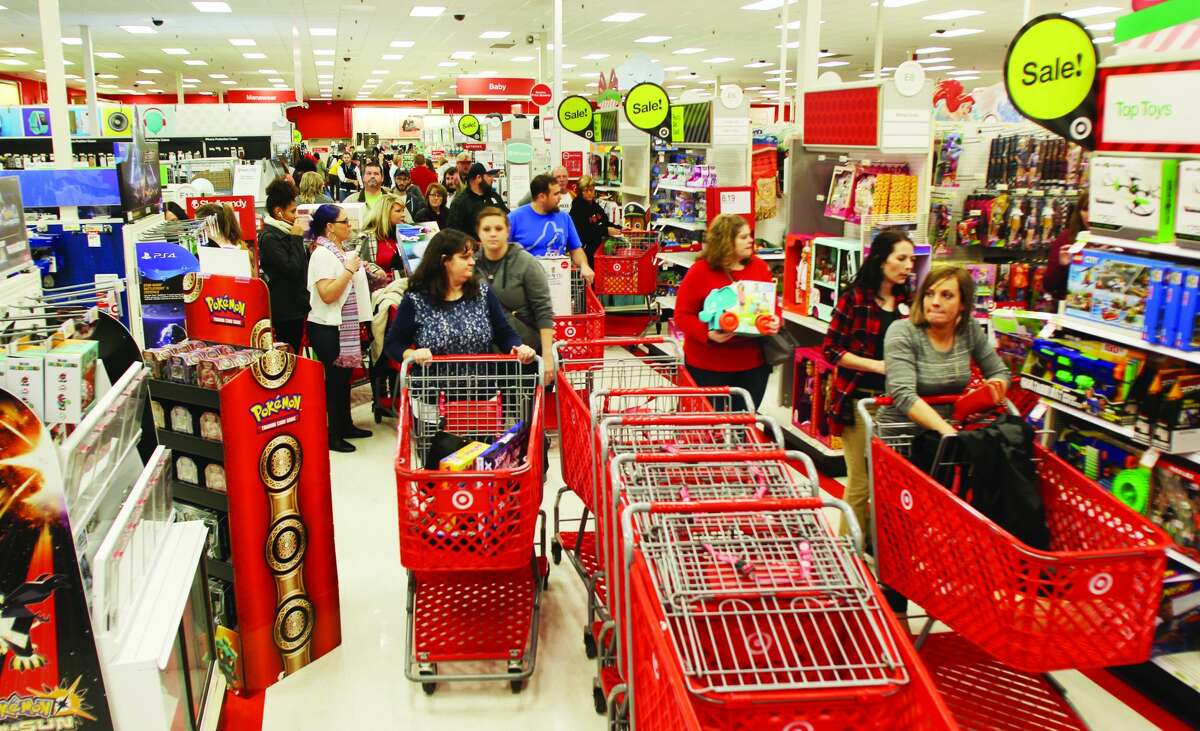 Thanksgiving Day crowds work their ways through the aisles near electronics in the Alton Target store during a pre-pandemic weekend. Last year many shoppers avoided the stores on the traditional first day of the holiday shopping season. Most major retailers in Alton plan to be closed Thanksgiving Day.