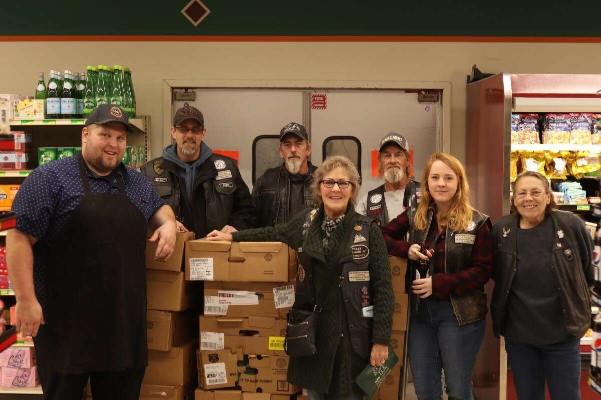 The Sawtooth Wolves Motorcycle Club put in a team effort to get 60 turkeys and thanksgiving meals delivered to area schools for distribution to local families. 