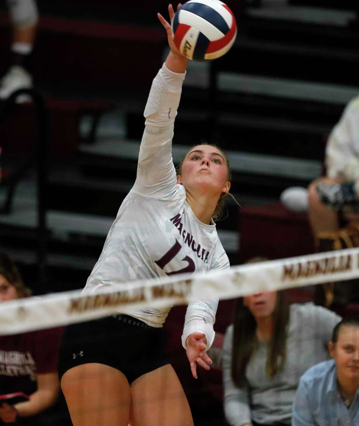 Magnolia outside hitter Sydney Gentry (12) takes a shot during the third set of a District 19-5A high school volleyball match at Magnolia West High School, Tuesday, Sept. 21, 2021, in Magnolia.
