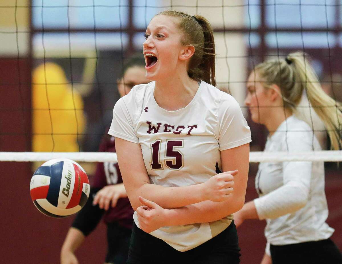 Magnolia West’s Evyn Snook (15) reacts after blocking a shot during the first set of a District 19-5A high school volleyball match at Magnolia West High School, Tuesday, Sept. 21, 2021, in Magnolia.