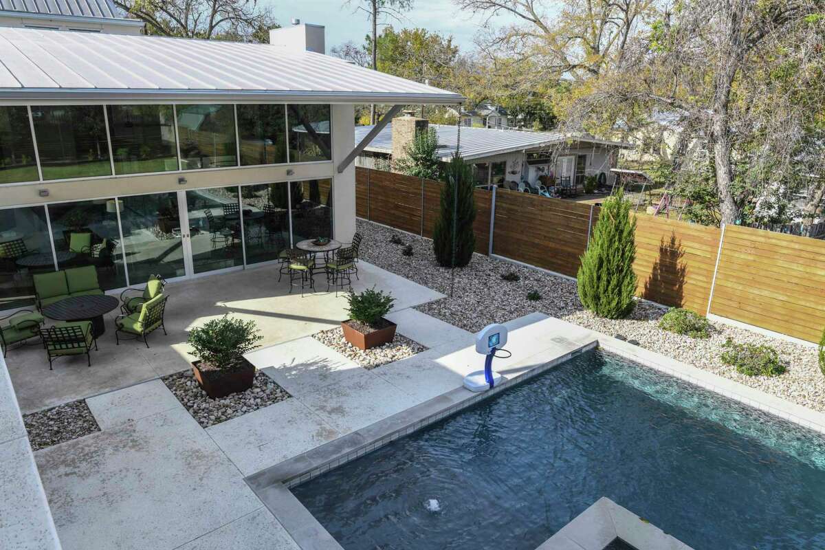 The homeowners didn't want the view to the patio and beyond to be obstructed, so the architect designed a cantilever to provide shade without any supporting posts.