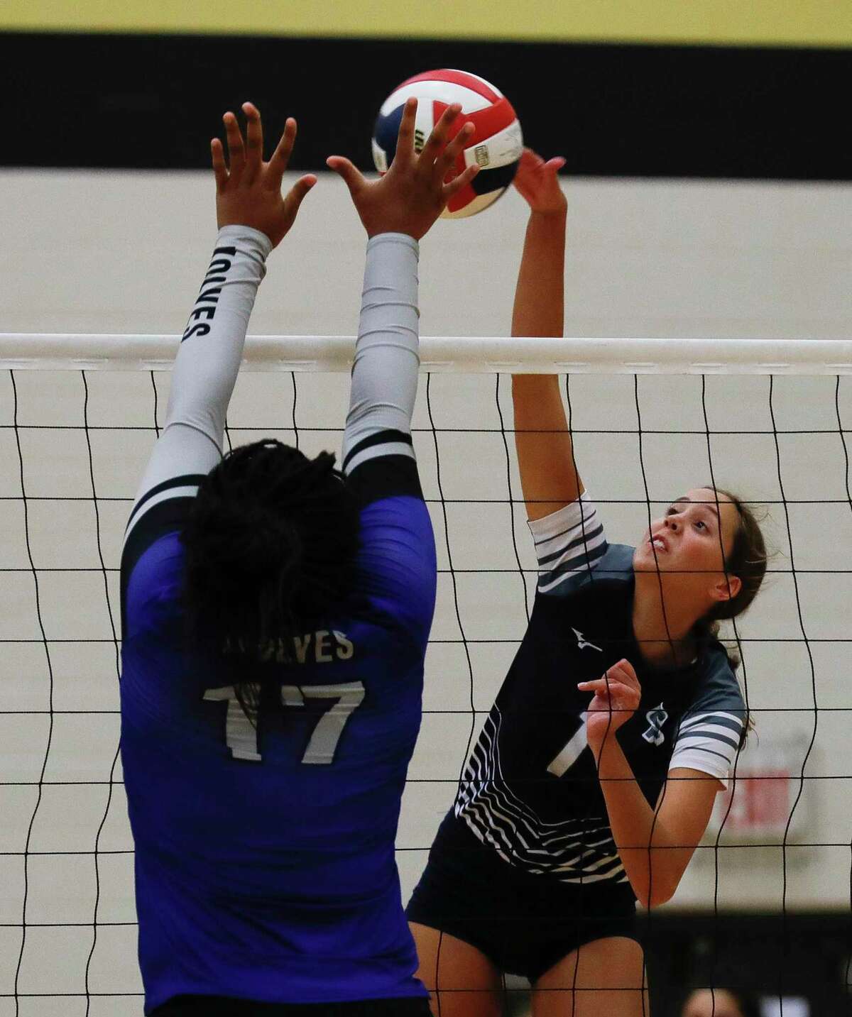 College Park’s Paige Palmer (1) gets a shot off during a high school volleyball tournament at Cedar Park High School, Thursday, Aug. 12, 2021, in Cypress.