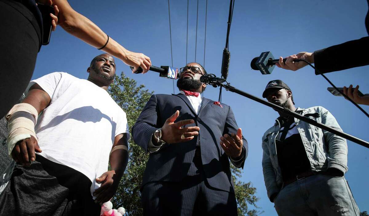 Samuel Bush, from left, his attorney Larry Taylor, Jr., and his nephew Jackson Bush speak to reporters about their lawsuit in response to the tragedy at the Astroworld music festival Monday, Nov. 22, 2021, at NRG Park in Houston. The Bushes said they had worked as security guards at the festival.