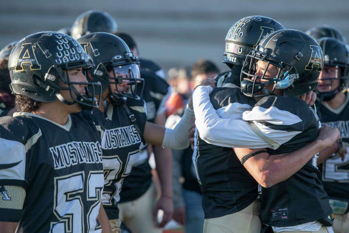 Andrews' players console each other following the 43-33 loss to Springtown 11/22/2021 at the Class 4A Division 1 area playoff at the Mustang Bowl in Sweetwater, Texas. Tim Fischer/Reporter-Telegram
