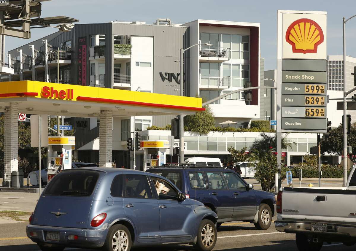 Drivers select from various fuels priced near or above $5.99 at a Shell gas station in Los Angeles in mid-November 2021.