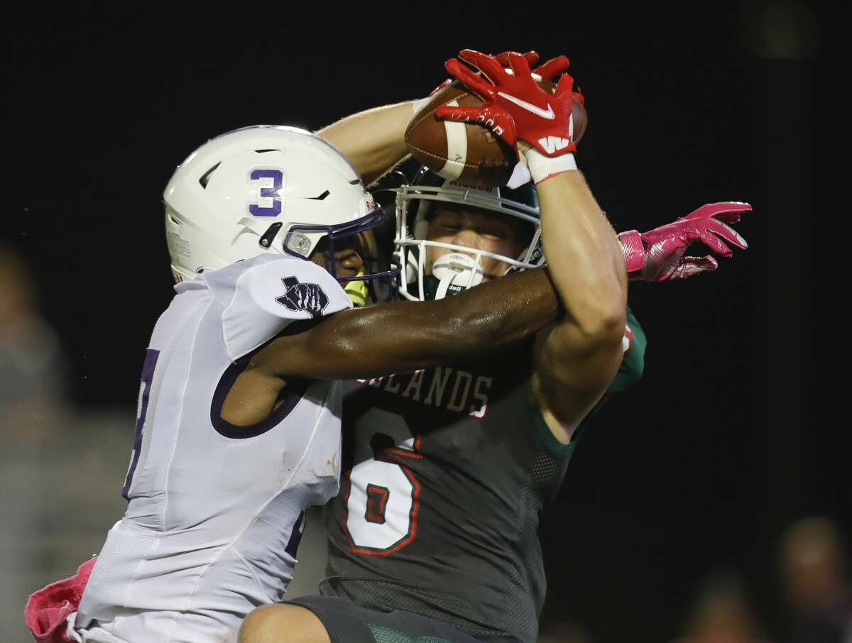The Woodlands wide receiver Ben Ferguson (6) catches a 27-yard pass as Willis defensive back Tallas Harrison (3) defends during the second quarter of a District 13-6A high school football game at Woodforest Bank Stadium, Thursday, Oct. 7, 2021, in Shenandoah.