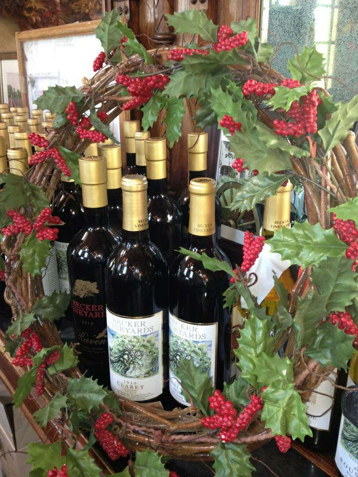 Becker Vineyards wines are displayed with a holiday wreath.