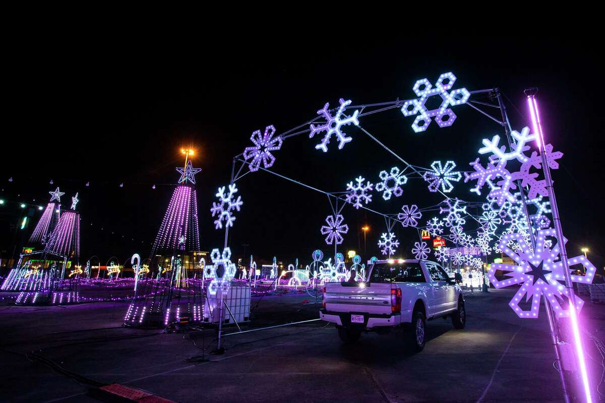 Scenes from The Light Park, a new drive-through holiday experience are shown Monday, Nov. 2, 2020 in Spring. The attractions include a 700-foot long animated LED tunnel. All told, the park boasts more than 1 million LED lights for a one-mile show that is synched and choreographed to holiday music on a dedicated station. "Character DJs" including Santa, DJ Snowflake, Pixel Penguin and Barry Bear will work candy-cane turntables, adding to the cheer. Each pass-through ride will be different.