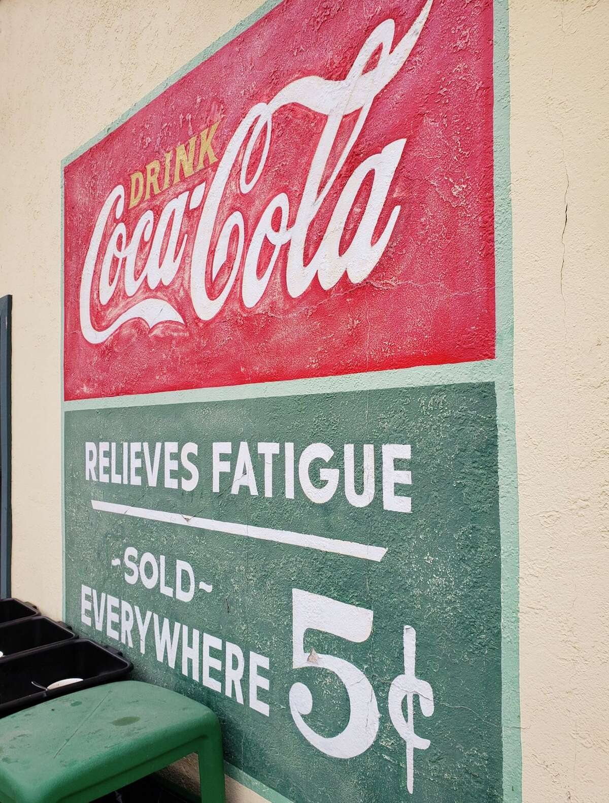 Under the shady trees of Bob's Well Bread bakery in Los Alimos, Calif., There were picnic tables and a bocce court next to a vintage Coca Cola sign offering to 