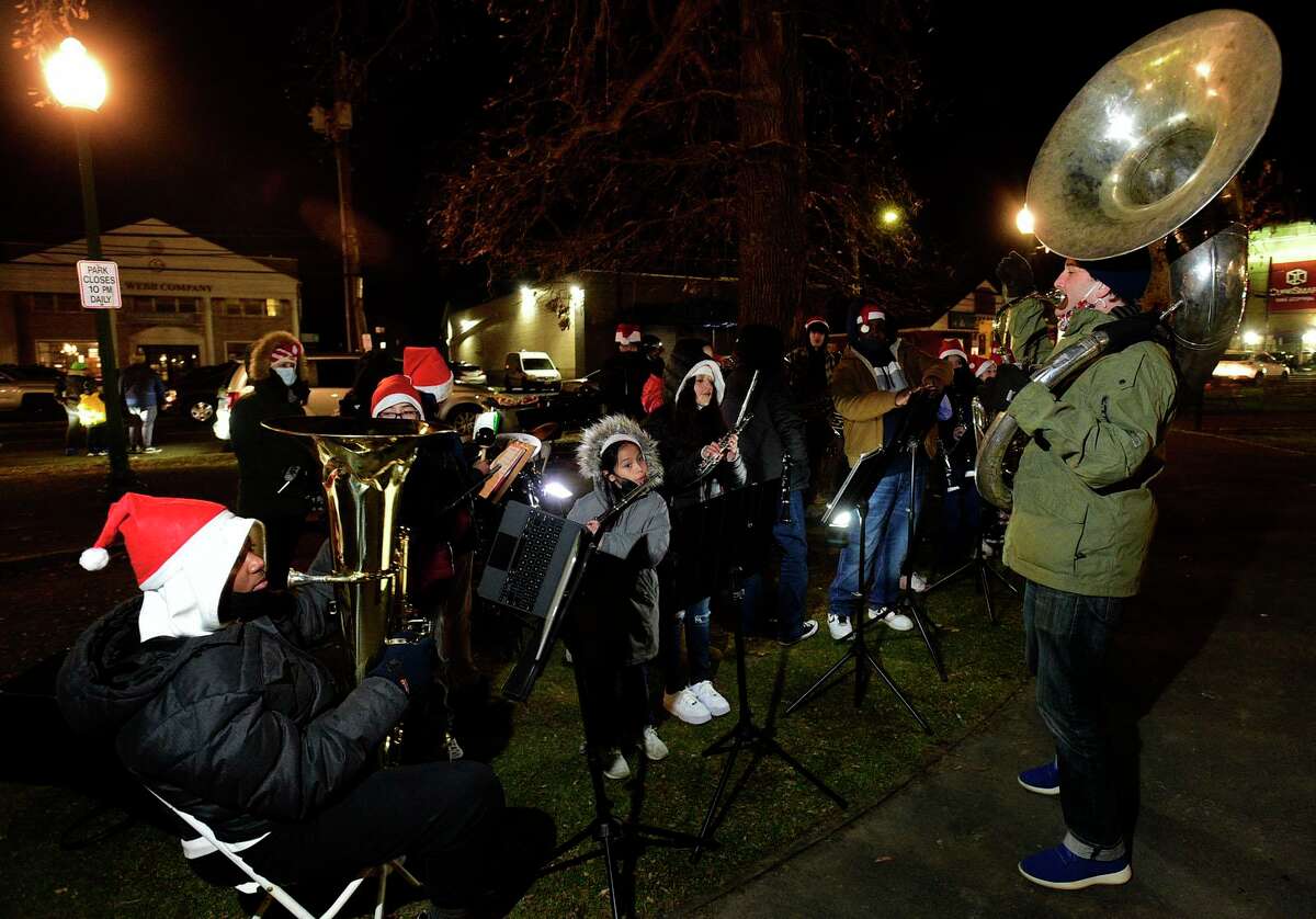 Children with project music play Christmas song during the 25th Annual Community Christmas Tree Lighting and Christmas Caroling in Jackie Robinson Park at West Main Street and Richmond Hill Avenue Tuesday, November 23, 2021, in Stamford, Conn.