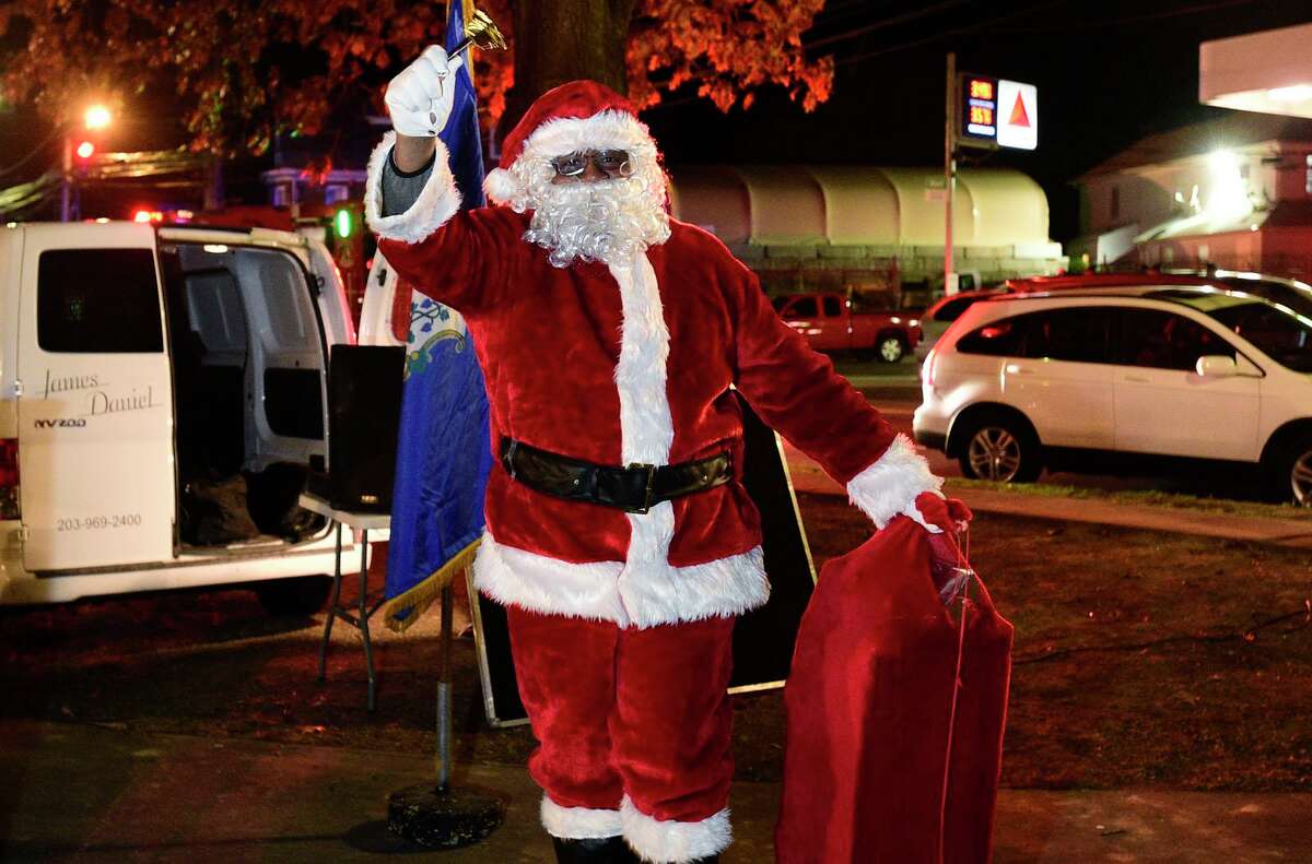 Santa, aka Thomas Patterson, arrives for the 25th Annual Community Christmas Tree Lighting and Christmas Caroling in Jackie Robinson Park at West Main Street and Richmond Hill Avenue Tuesday, November 23, 2021, in Stamford, Conn.