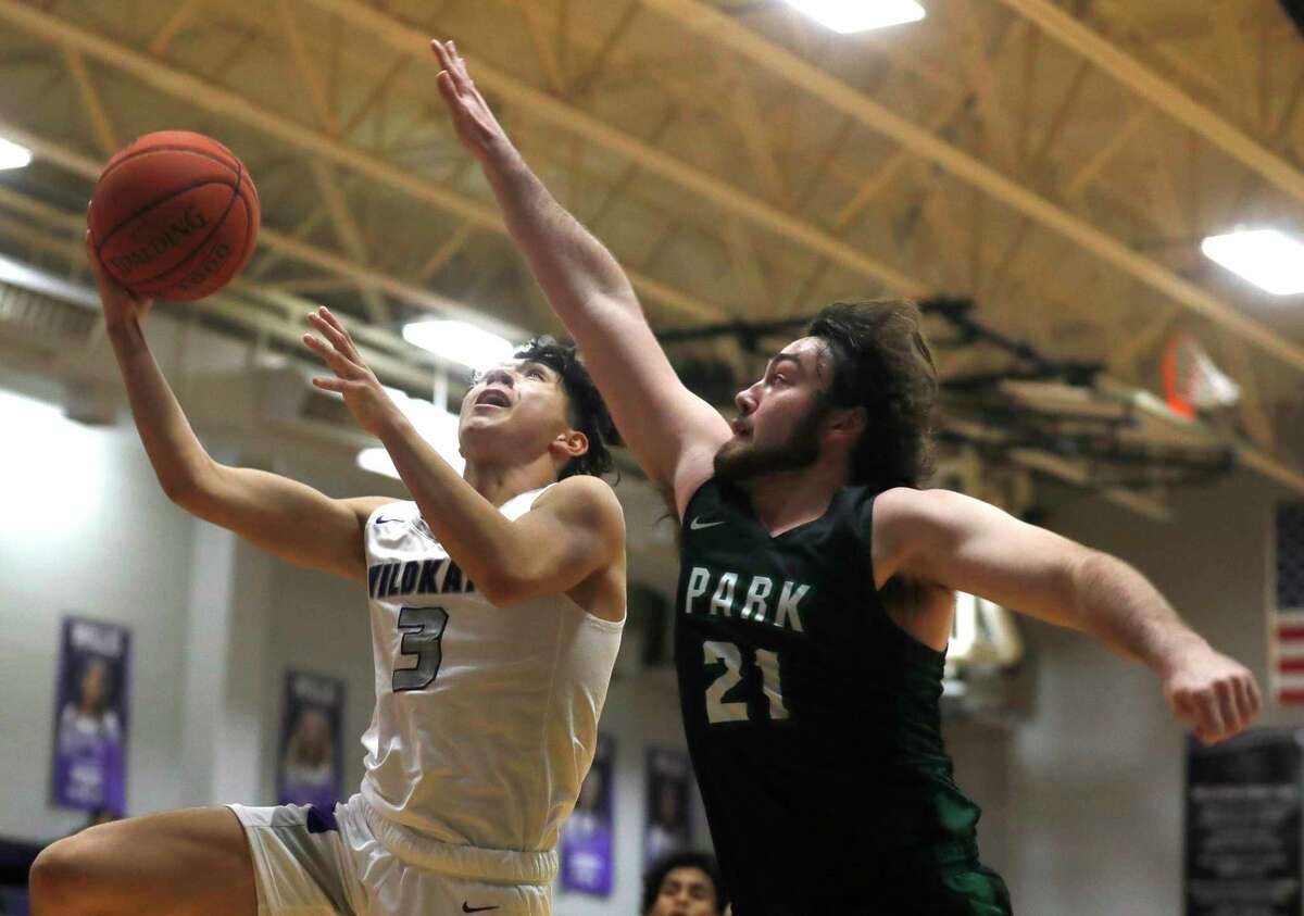 Willis guard Julia Pelayo (3) shoots under pressure from Kingwood Park power forward Quinn Keeler (21) during the first quarter of a high school basketball game at Willis High School, Tuesday, Nov. 23, 2021, in Willis.