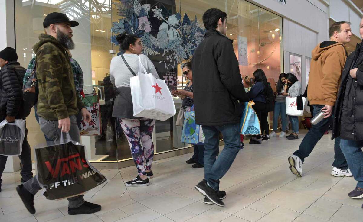 Shoppers stroll the Danbury Fair mall in Danbury, Conn. on Black Friday in November 2019.