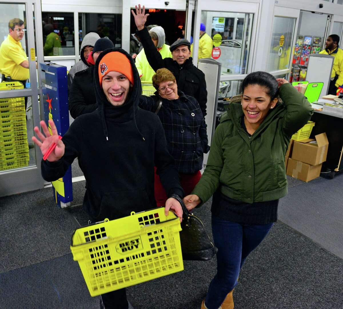 Holiday shoppers enter a Best Buy in Trumbull, Conn., on Thanksgiving day of 2014. The chain is among a large number nationally that will stay closed on Thanksgiving in 2021, with plans for early shopping hours on the morning of Black Friday.