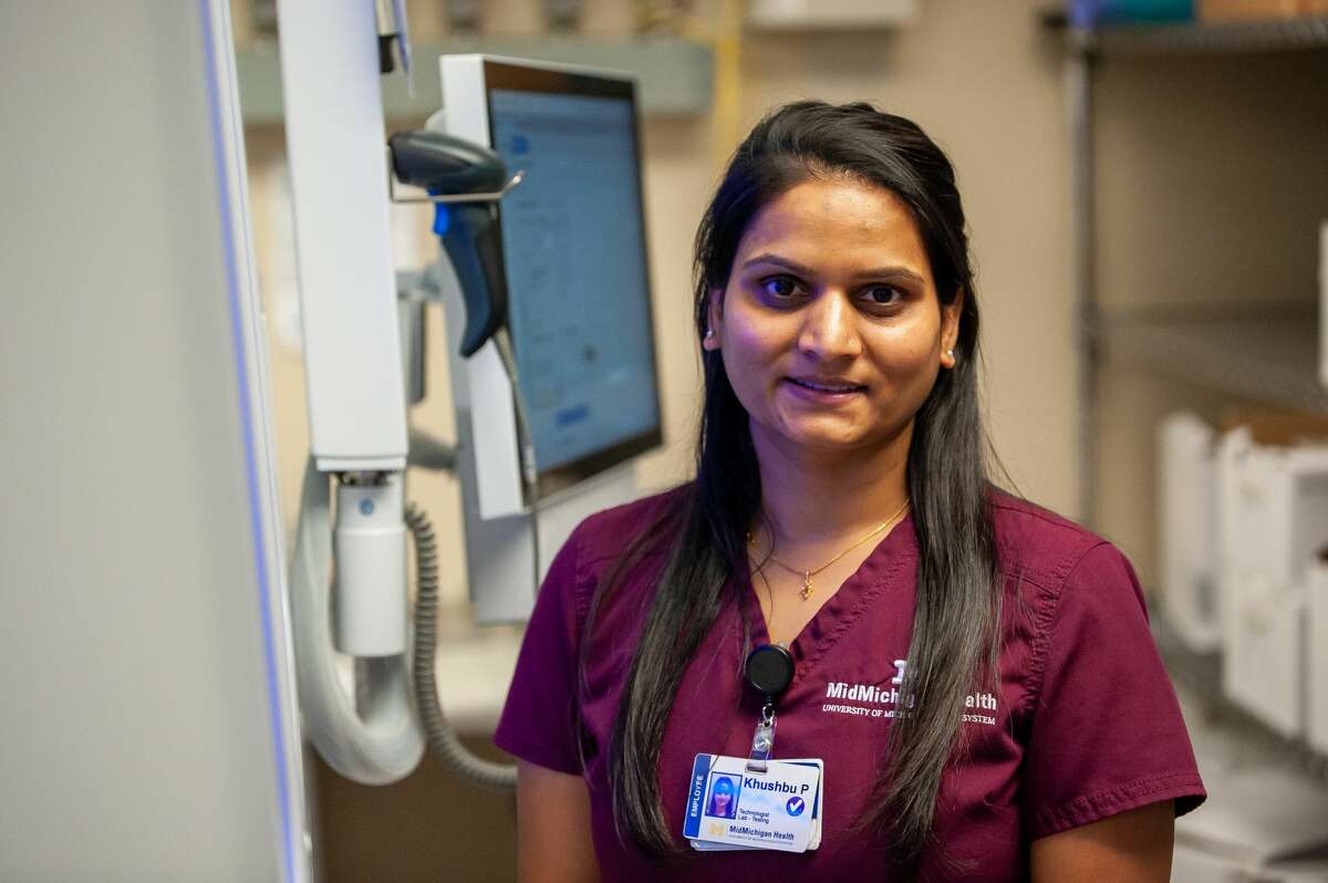MidMichigan medical lab scientist Khushbu Patel poses in the MidMichigan health microbiology lab on Nov. 23, 2021.