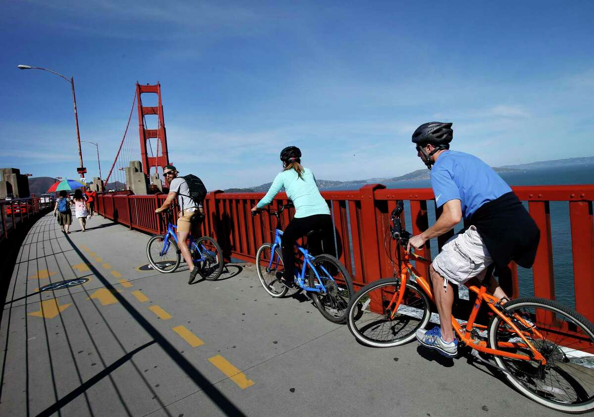 Cyclists prepare to cross the Golden Gate Bridge from the south side Tuesday October 21, 2014.
