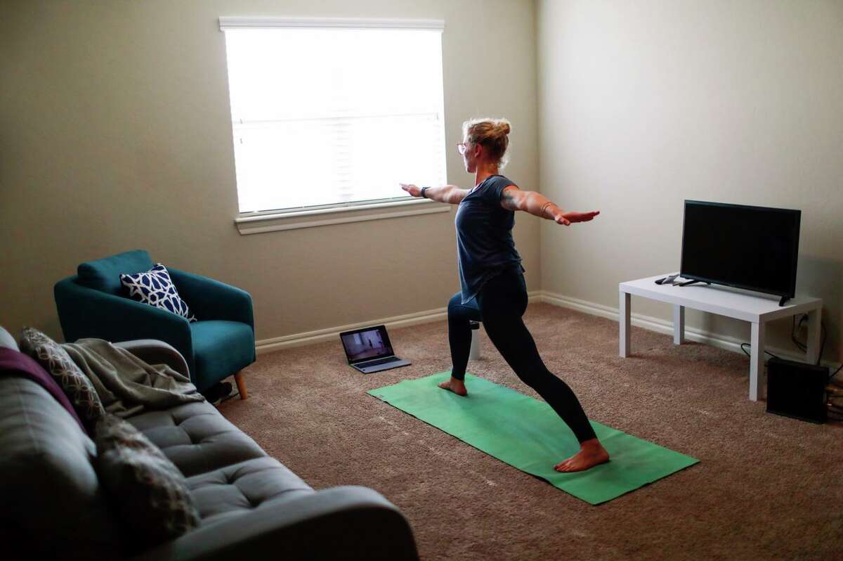Taub does yoga after a full day of performing abortions at the Trust Women clinic, which has seen demand surge since a recently passed Texas law banned nearly all abortions there.