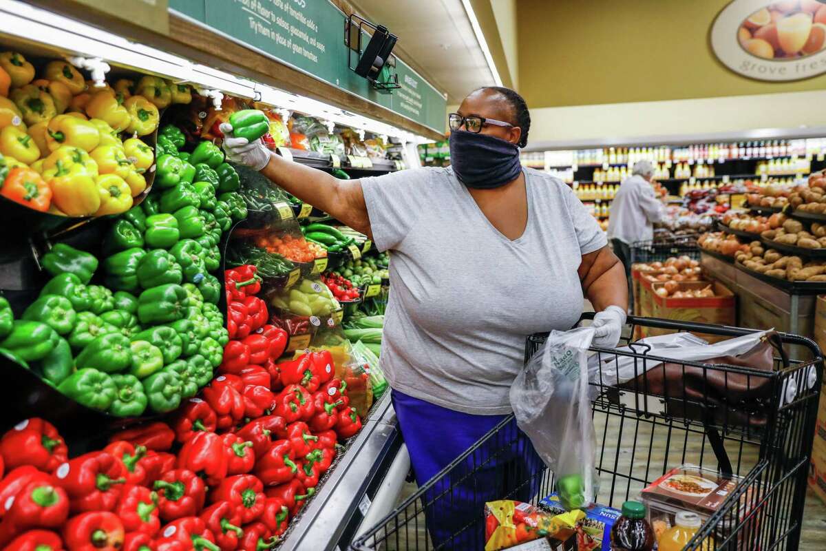 Esther Williams shops for groceries for her family at Safeway in Mill Valley, California on Tuesday, March 31, 2020.
