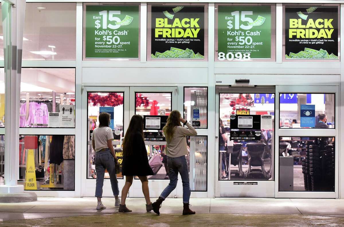Women walk into Kohl’s in the Forum shortly after 5 a.m. on Black Friday last year. Law enforcement officials are urging shoppers to be vigilant, as car thefts and car break-ins are up this year and are particularly prevalent in store and mall parking lots.