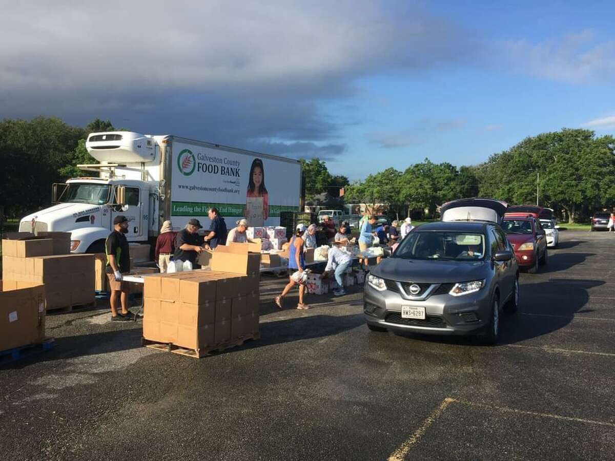 Volunteers distribute fresh fruits, vegetables, meat and hygiene items during a recent food drive coordinated by St. Thomas the Apostle Episcopal Church and the Galveston Food Bank. The next distribution event will be 7:45 a.m. Dec. 4 at 18300 Upper Bay Road. Email Mike Stone, rector@sttaec.org, for details.