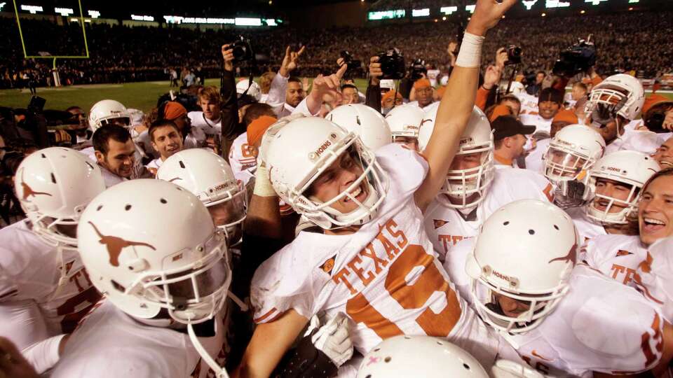 Texas kicker Justin Tucker (19) is carried off the field by his teammate after kicking a 40-yard field goal to beat Texas A&M during the fourth quarter of an NCAA college football game at Kyle Field Thursday, Nov. 24, 2011, in College Station. Texas beat Texas A&M 27-25. ( Brett Coomer / Houston Chronicle )