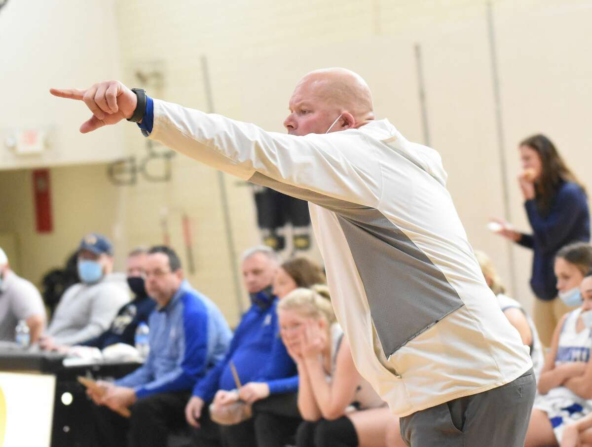 Marquette coach Lee Green shouts out instructions against Belleville West during the fourth quarter of the Southern Illinois Girls Basketball Shootout Series in O'Fallon.