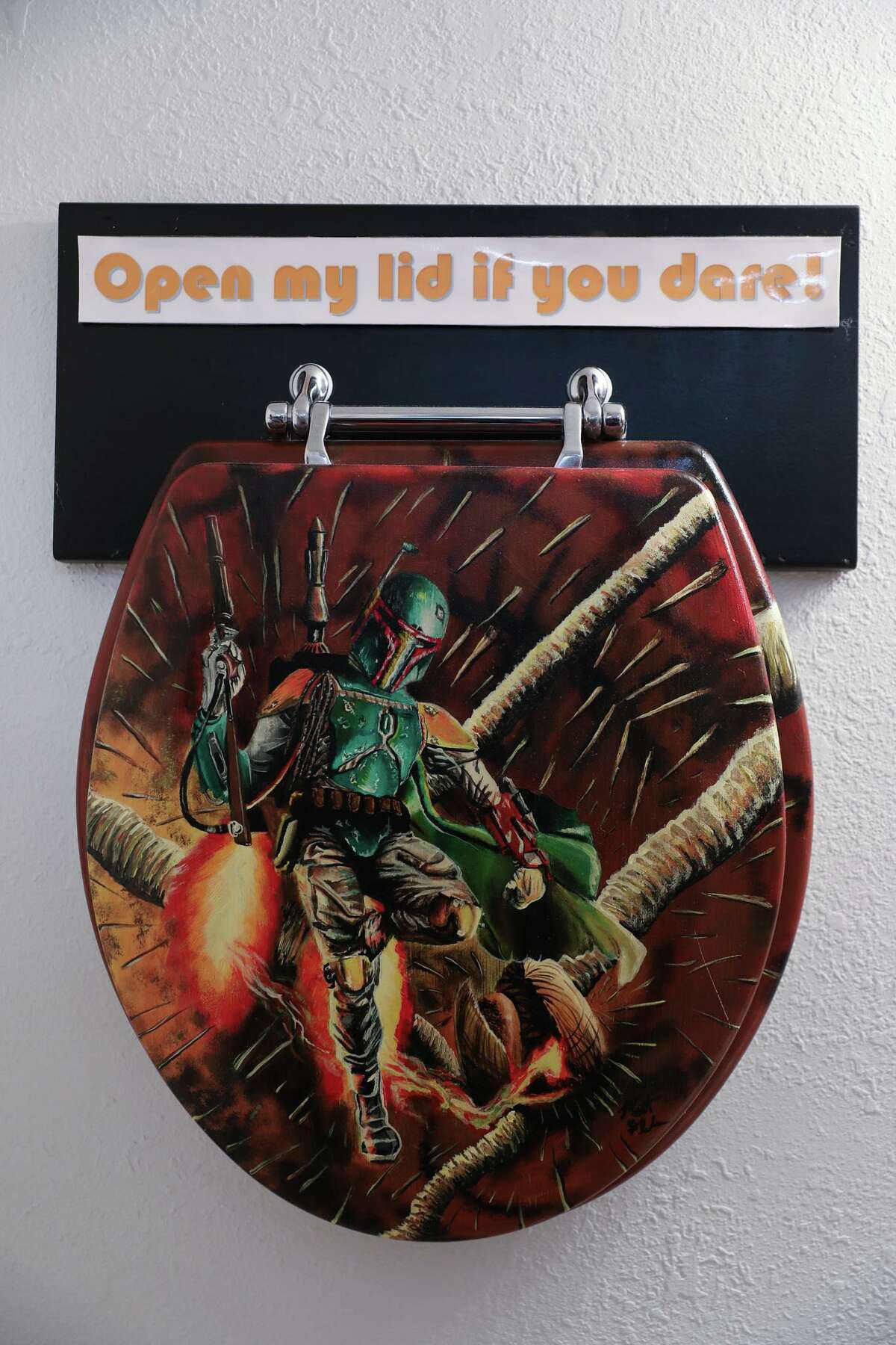 A toilet seat featuring Boba Fett hangs on the bathroom wall at Rancho Obi-Wan. The museum has items ranging form the original “Star Wars” trilogy to the recent “Mandalorian” TV series.