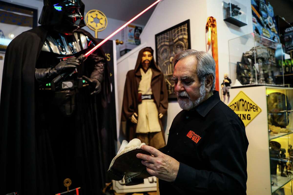 Steve Sansweet, founder of Rancho Obi-Wan, a Star Wars Museum, stands next to a Darth Vader mannequin.
