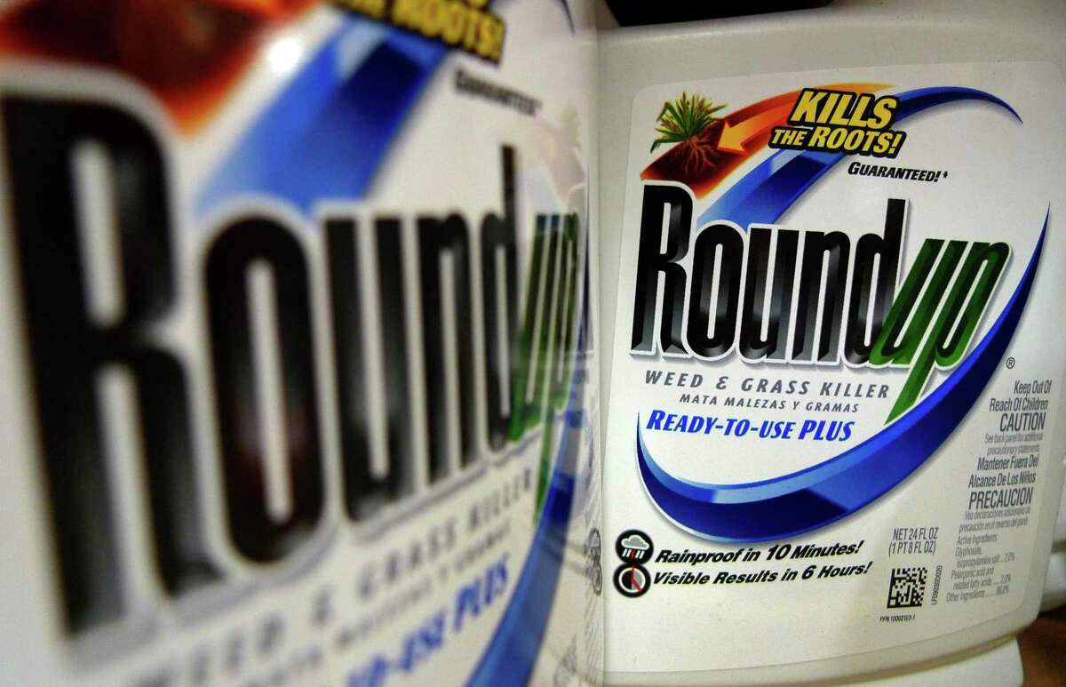 Bottles of Roundup herbicide, a product of Monsanto, are displayed on a store shelf.