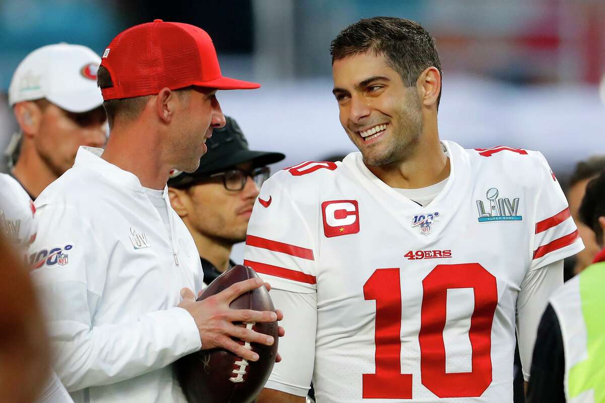 In this file photo, head coach Kyle Shanahan of the San Francisco 49ers talks with Jimmy Garoppolo (10) prior to Super Bowl LIV against the Kansas City Chiefs at Hard Rock Stadium on February 2, 2020 in Miami, Florida. (Kevin C. Cox/Getty Images/TNS)