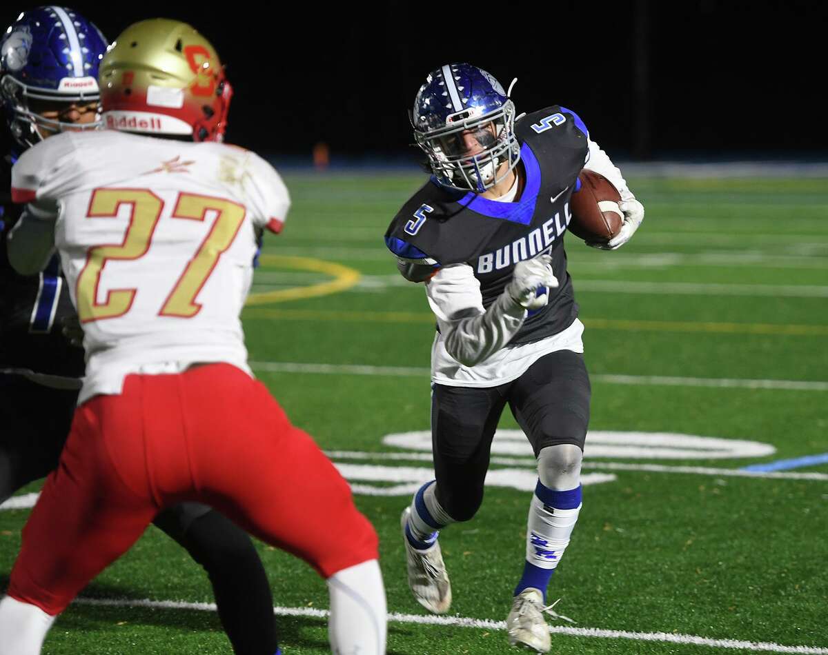 Bunnell's Michael Trovarelli runs the ball during their Thanksgiving eve football game with cross town rival Stratford at Bunnell High School in Stratford, Conn. on Wednesday, November 24, 2021.