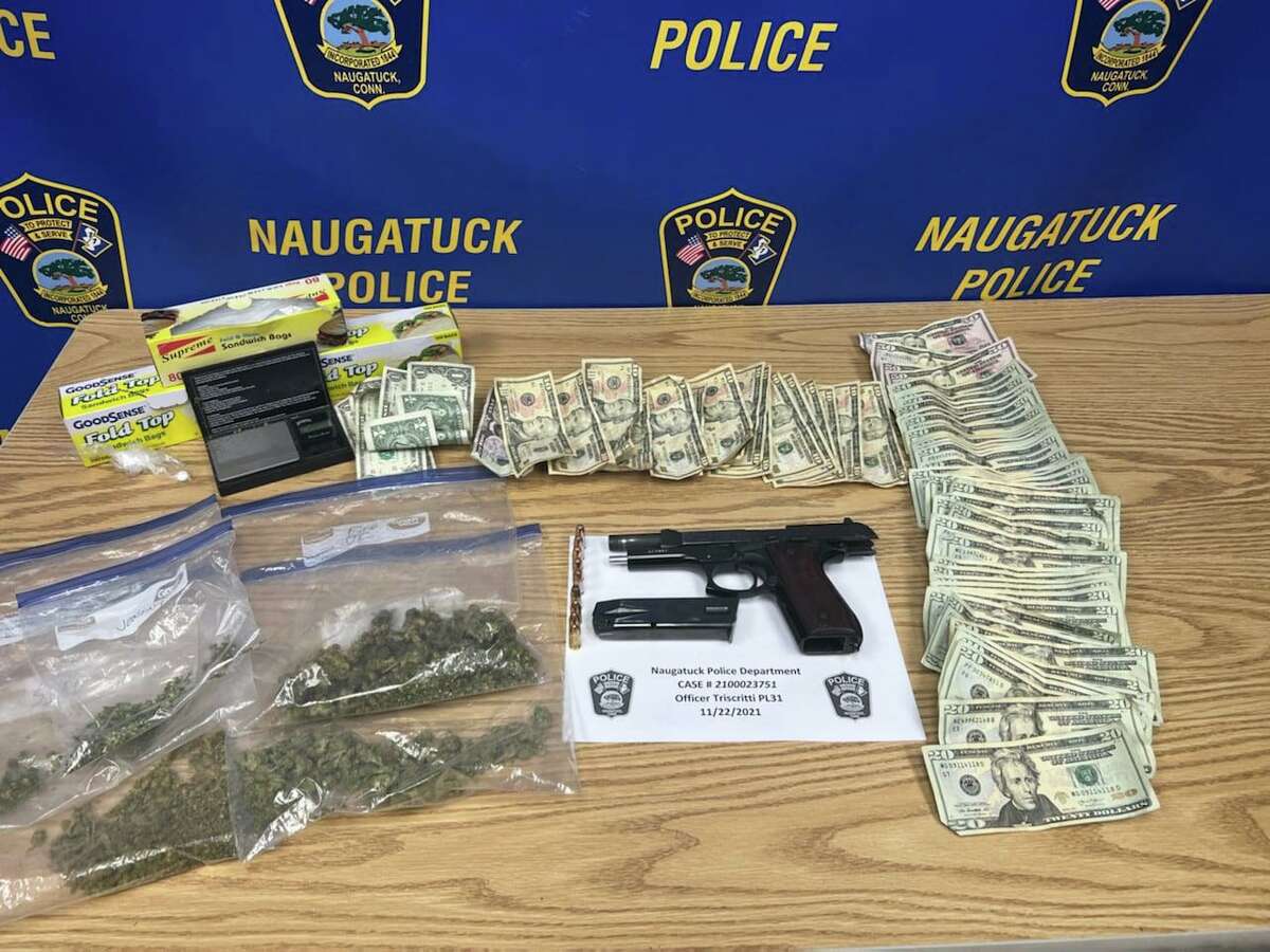 Police said officers found a stolen 9mm handgun, three ounces of marijuana, Percocet, a digital scale and over $1,200 in cash during a traffic stop in Naugatuck, Conn., on Monday, Nov. 22, 2021.