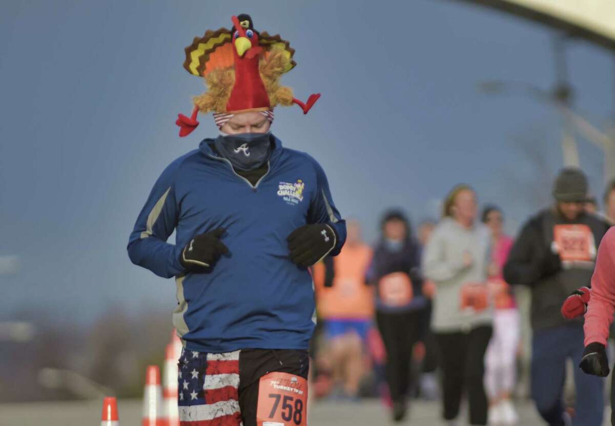 Runners make their way along the course during the 10K Troy Turkey Trot on Thursday, Nov. 25, 2021, in Troy, N.Y.