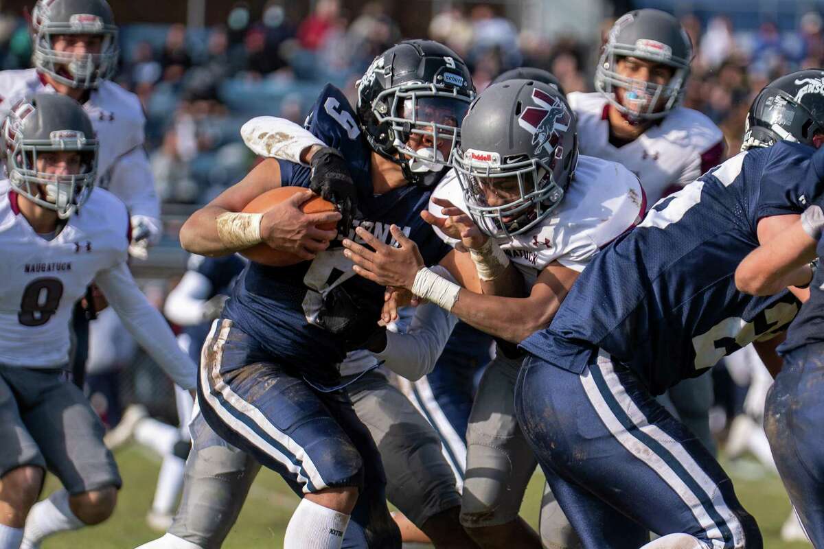 Ansonia's Darell McKnight gets stopped by the Naugatuck defense on Thanksgiving Day at Jarvis Stadium