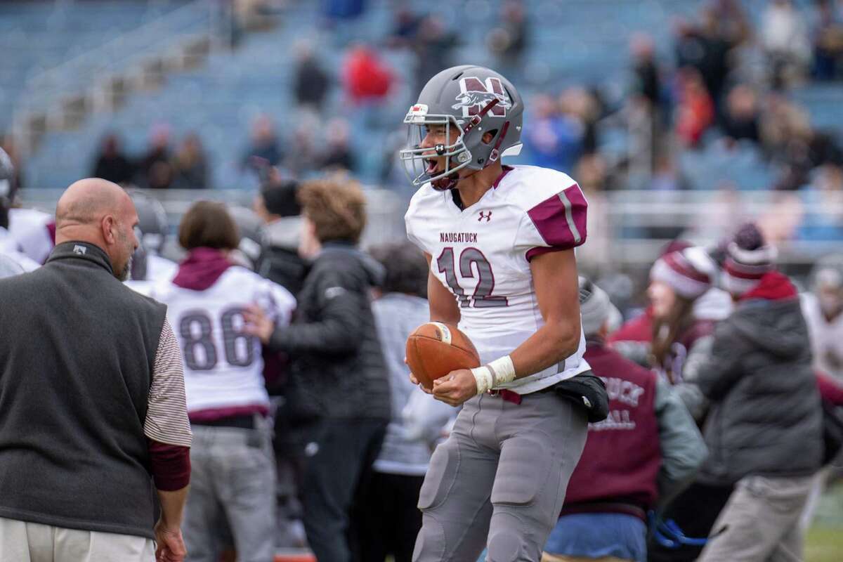 Naugatuck High's Jibree Bartelle celebrates as time runs out on Naugatuck's 14-7 victory over Ansonia High on Thanksgiving Day at Jarvis Stadium