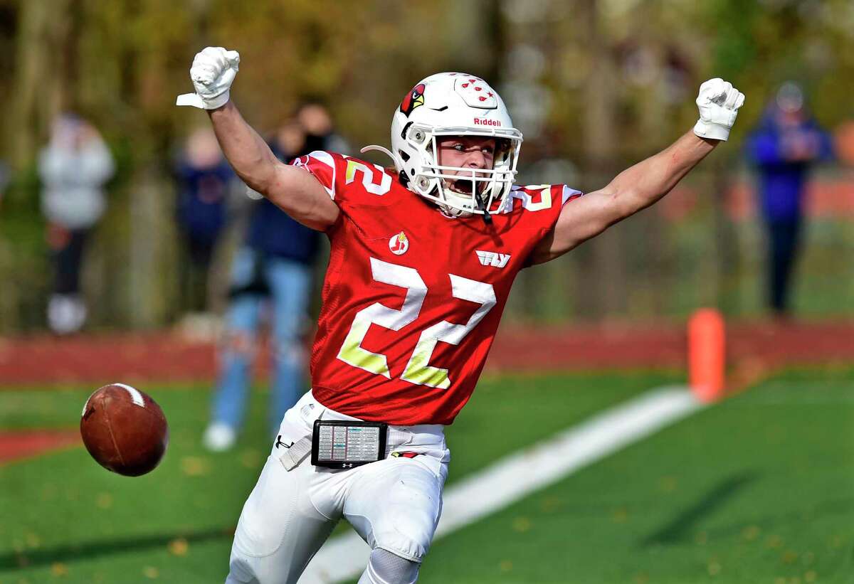Greenwich's Thomas Foster (22) reacts after scoring a touchdown in overtime during Thanksgiving Day football action against Staples in Greenwich, Conn., on Thursday November 25, 2021.
