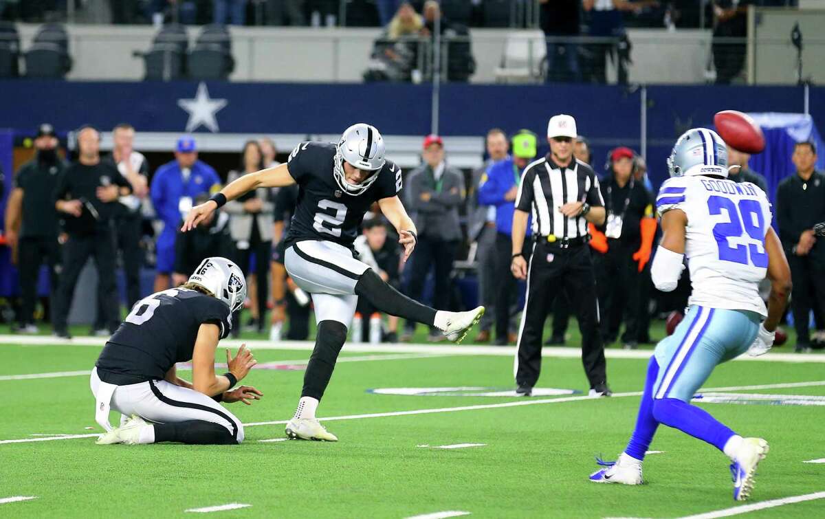 ARLINGTON, TEXAS - NOVEMBER 25: Daniel Carlson #2 of the Las Vegas Raiders kicks the winning field goal in overtime of the NFL match between Las Vegas Raiders and Dallas Cowboys at AT&T Stadium on November 25, 2021 in Arlington, Texas. (Photo by Richard Rodriguez/Getty Images)