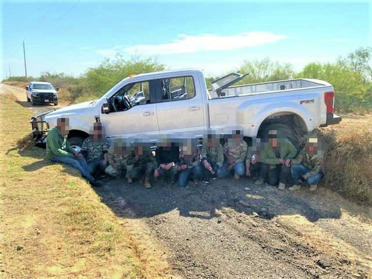 These migrants were apprehended after the pickup they were riding in got stuck in a ditch.