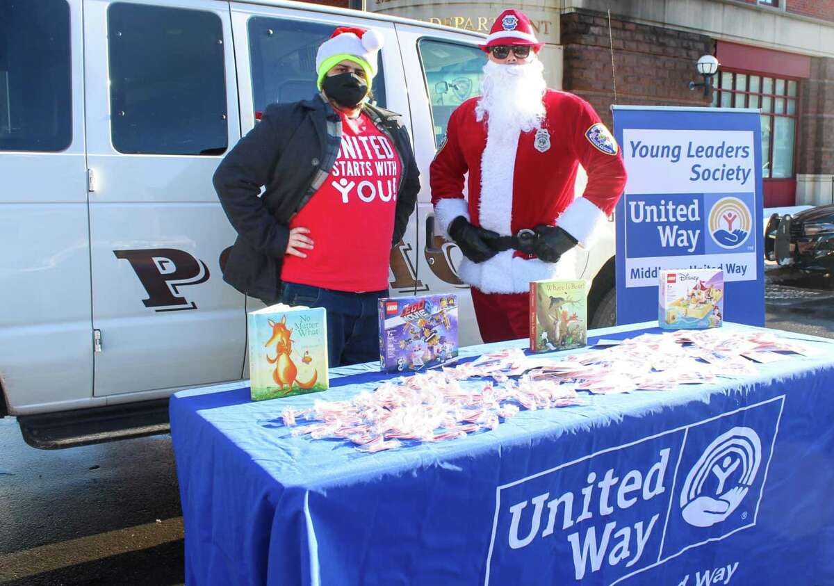 The Middlesex United Way Young Leaders Society will host its seventh annual Holiday Social & Stuff-a-Cruiser at the Middletown Police Department Dec. 4 from 10 a.m. to 2 p.m. Here, Officer Jay Bodell plays Santa Clause.