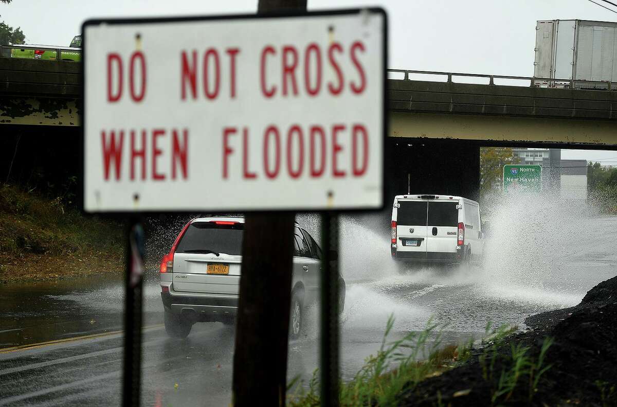 Vehicles cross a flooded viaduct during a storm last month in Stratford.