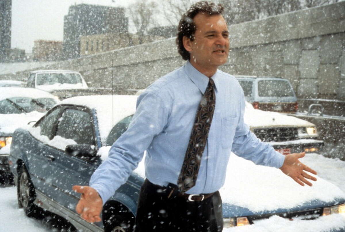 Bill Murray runs through the snow in a scene from the film "Groundhog Day."