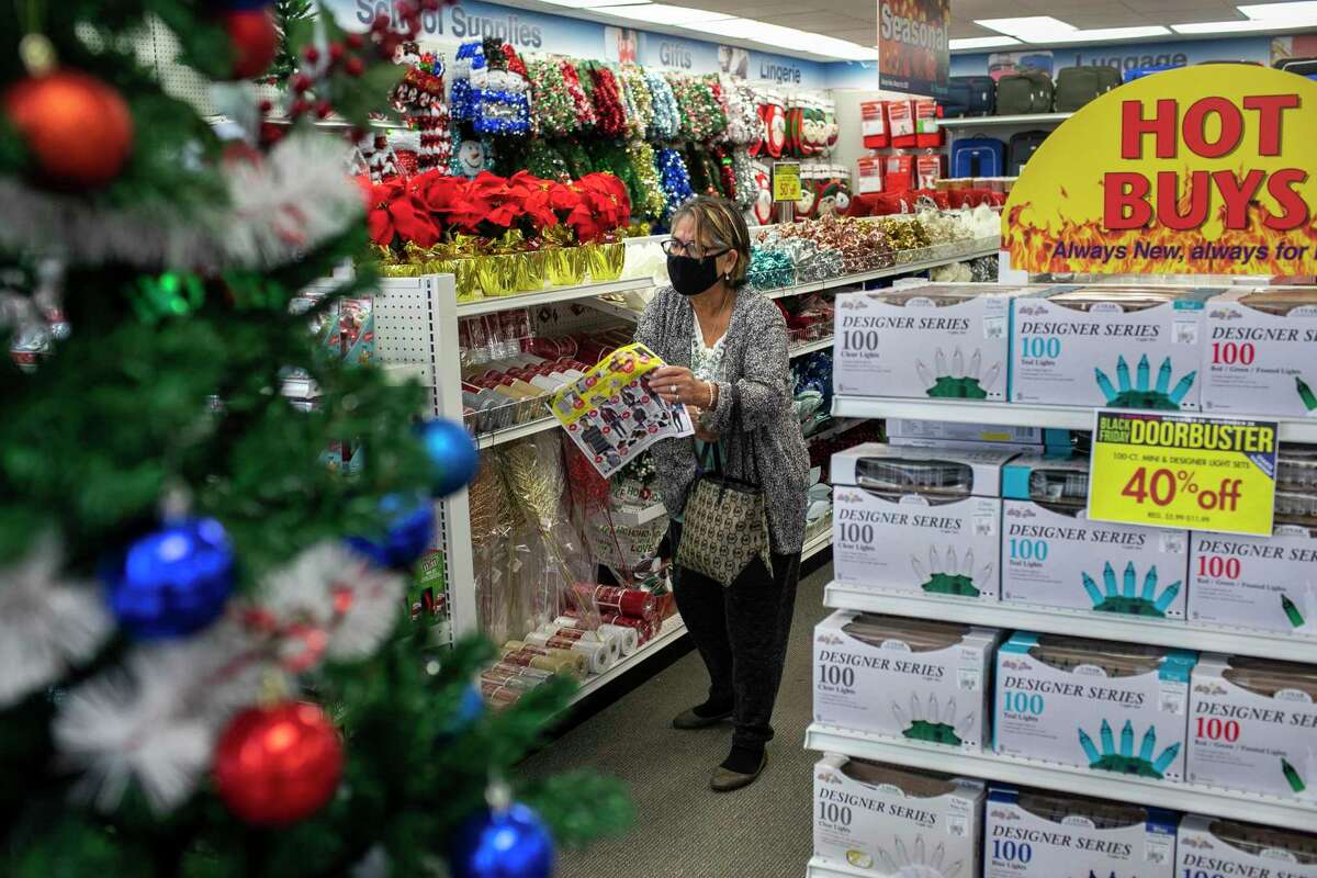 A shopper looks through aisles at the newly opened Shoppers World store on Black Friday at South Park Mall.